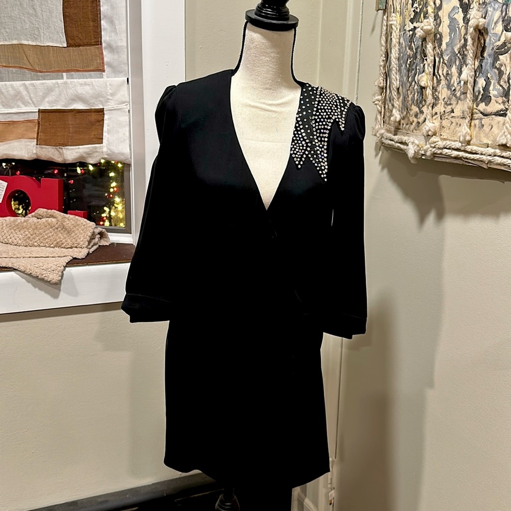 Saint Laurent stunning black wrap mini dress
Gorgeous crystal appliqué shoulder